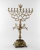Synagogue Hanukkah lamp surmounted by crowned eagle holding scepter and sword