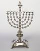 Hanukkah lamp shaped like the Temple Menorah and surmounted by figure of Judith
