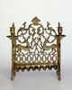 Hanukkah lamp shaped like papercut with depictions of gazelle, birds and side panels with lions