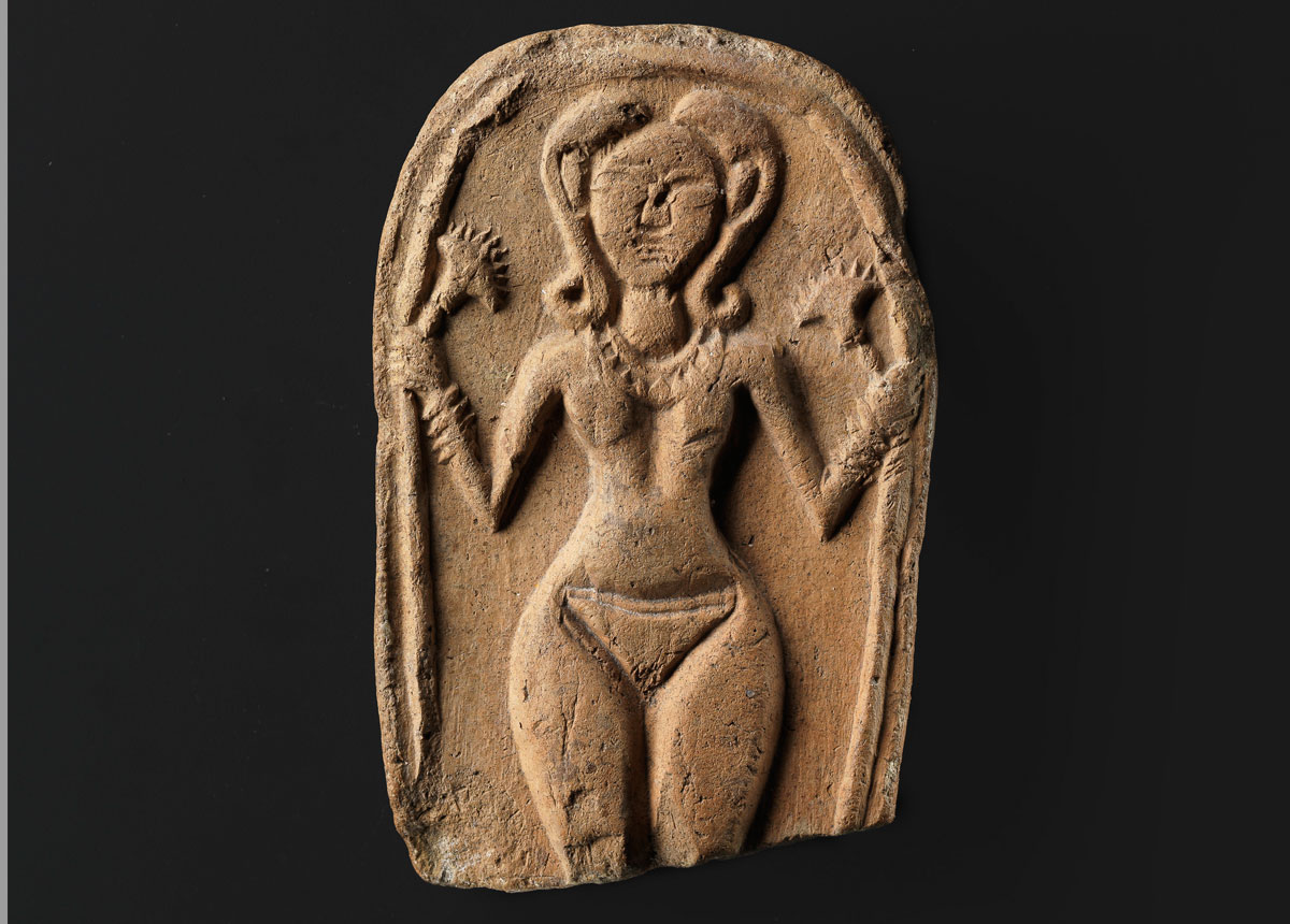Plaque figurine of a nude goddess